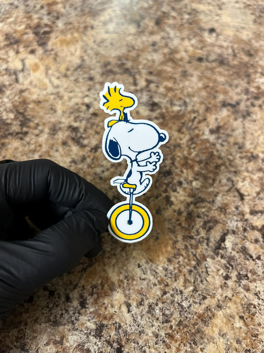 Unicycle Snoopy & Woodstock Sticker | Circus Beagle Balance Art | Peanuts Carnival Act Decal | 3"x1"