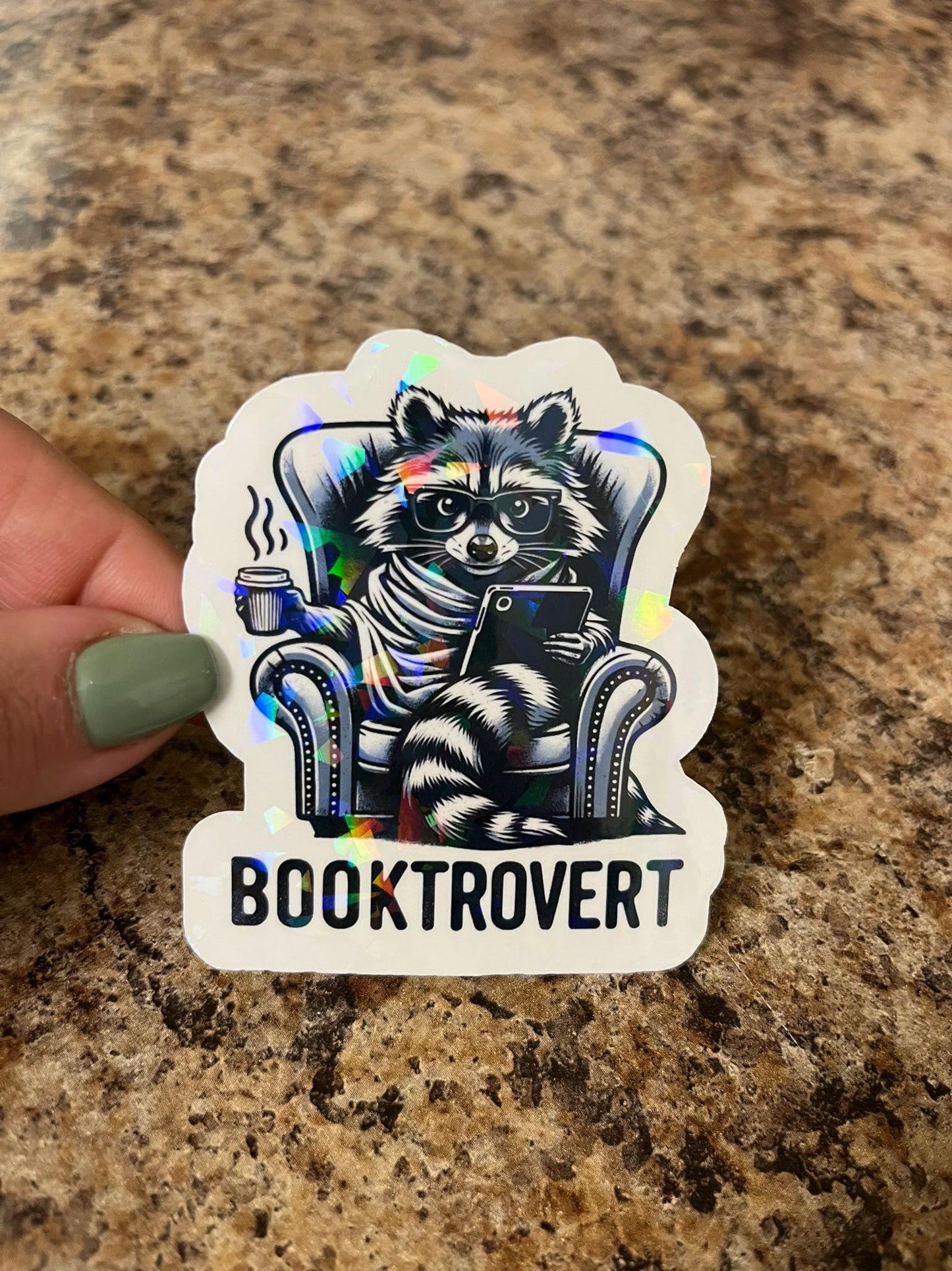 Holographic Booktrovert Raccoon Sticker | Rainbow Cozy Reader Decal | Introvert Book Lover Art | 3"x2.5"