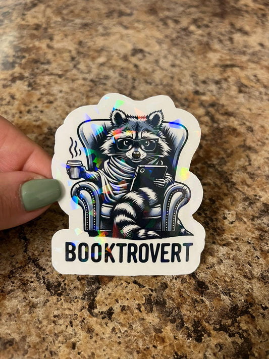 Holographic Booktrovert Raccoon Sticker | Rainbow Cozy Reader Decal | Introvert Book Lover Art | 3"x2.5"